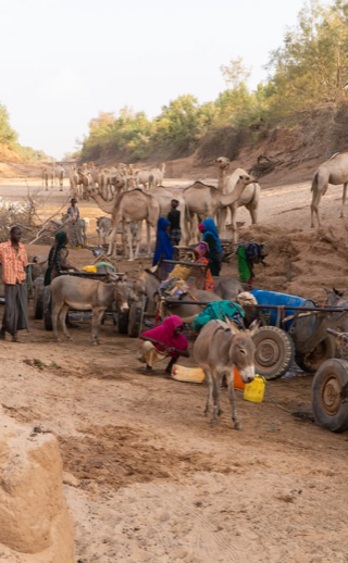 Islamic Relief Ethiopia aid workers distributing emergency water rations during a drought.