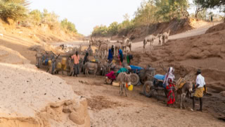 Islamic Relief Ethiopia aid workers distributing emergency water rations during a drought.